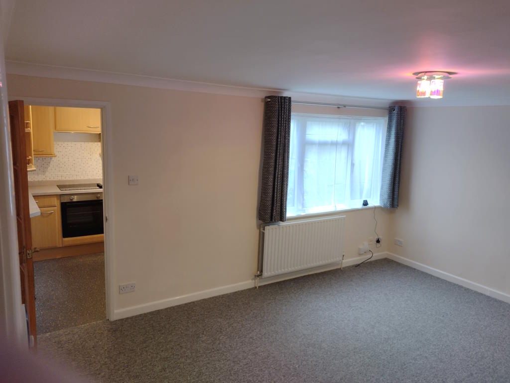 Lounge showing window and door to kitchen